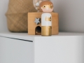 Wooden toys | A modern neutral millennial pink bedroom for children with handmade furniture, personalised artwork and statement lighting.