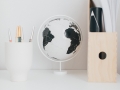 Monochrome Globe | Wooden Desk File | Wooden Desk Accessories | A Frame Desk | Neutral Desk Accessories | White Desk Chair | Statement Wall Light | A modern neutral millennial pink bedroom for children with handmade furniture, personalised artwork and statement lighting