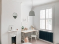 A modern neutral millennial pink bedroom for children with handmade furniture, personalised artwork and statement lighting